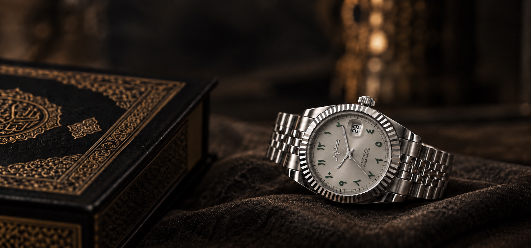 Sabrwatch timepiece beside an ornate book
